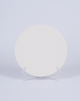 Tashkeel ceramic bisque plate with a smooth, off-white surface and simple, elegant design for decorative or serving use.
