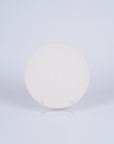 Tashkeel ceramic bisque plate with smooth, unglazed surface and rounded edges, showcasing a classic, handcrafted design.