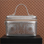 Small silver Mandoos leather bag by Tashkeel featuring a sleek design and compact size, perfect for stylish everyday use.