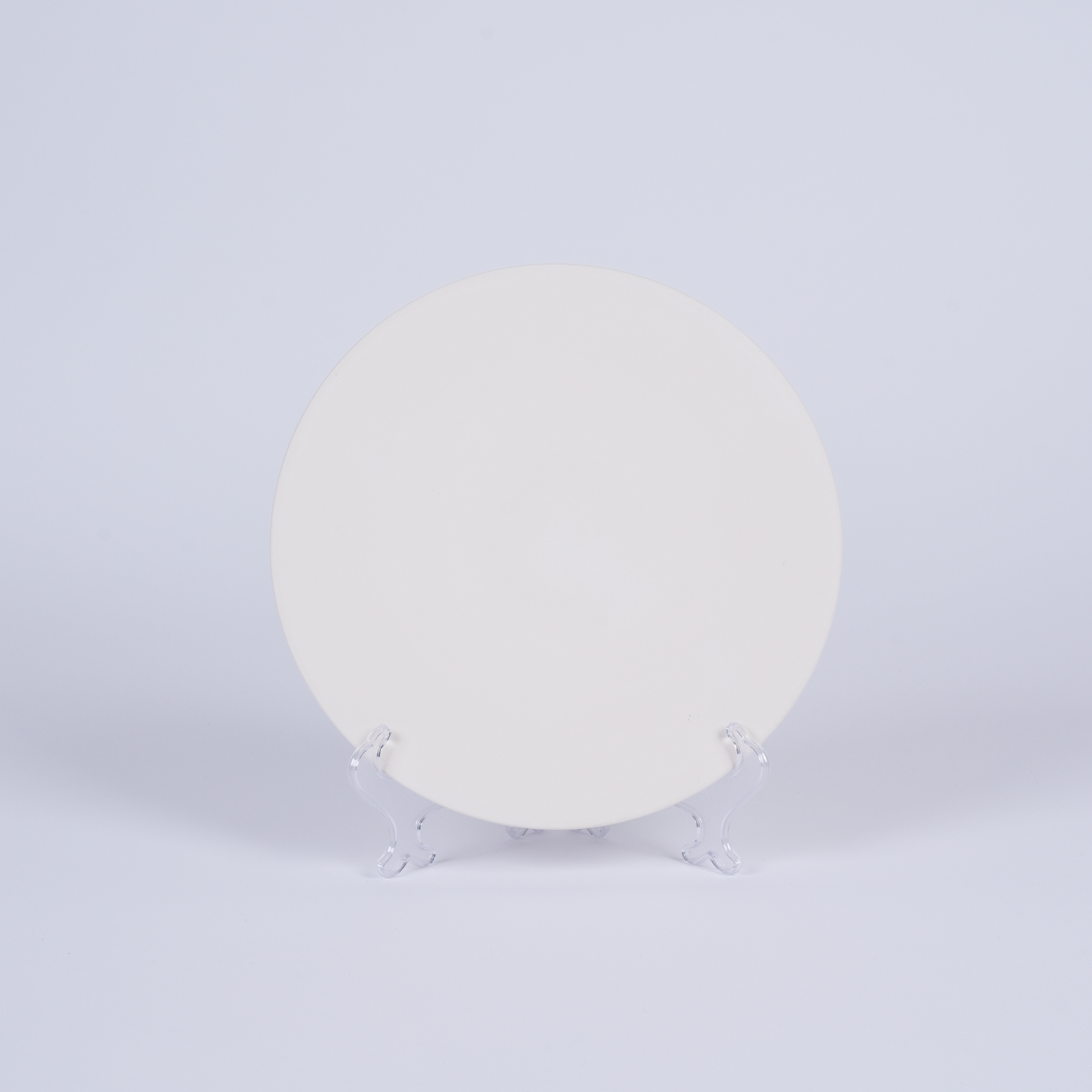 Tashkeel ceramic bisque plate with a smooth, off-white surface and simple, elegant design for decorative or serving use.