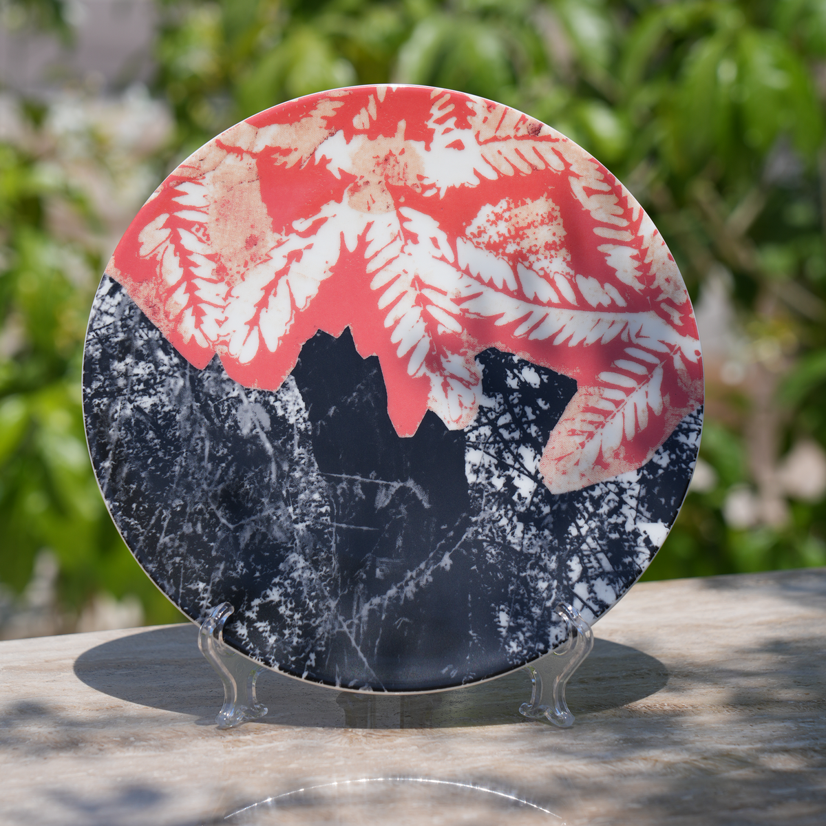 Set of four ceramic plates with Moza Al Falasi artwork from the Unfolding exhibition (view 2)